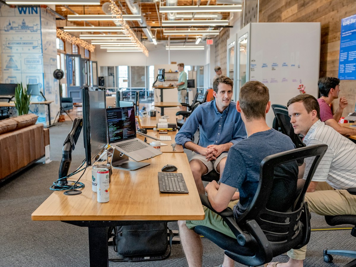 Team celebrating success in modern office