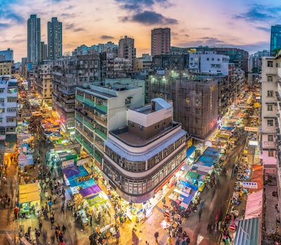 An image that showcases the bustling streets of Hong Kong with a prominent SEO agency sign in the foreground, symbolizing the minor advantages they offer